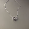 BOW IN CIRCLE NECKLACE