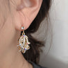 PEARL INSIDE OVAL EARRING